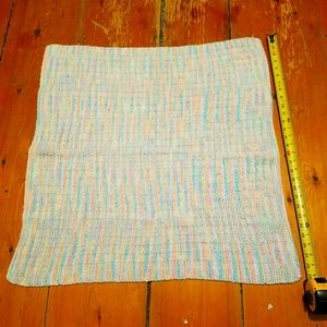 Homemade 30 in by 31 in blanket with strips.